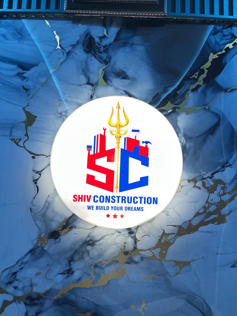 Shiv Construction circular illuminated logo sign close-up