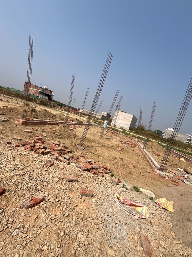Active foundation site with standing steel rebar column pillars ready for concrete casting by Shiv Construction